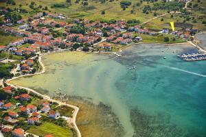 an aerial view of a beach with a group of houses at Apartmani Marko in Nin