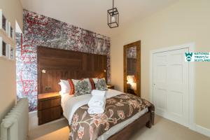 Un ou plusieurs lits dans un hébergement de l'établissement Johnstone Apartment by The National Trust Scotland