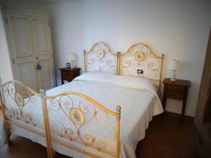 A bed or beds in a room at Teruzzi Country House