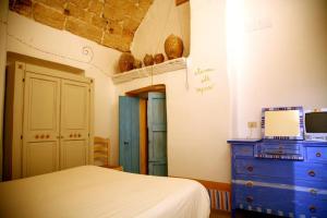 Una cama o camas en una habitación de B&B Palazzo Briganti