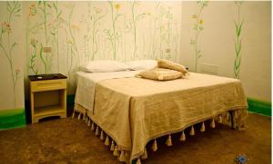 Cama o camas de una habitación en B&B Palazzo Briganti