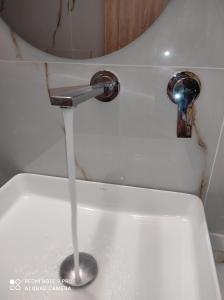 a stream of water pouring from a toilet at Iris in Pefkohori