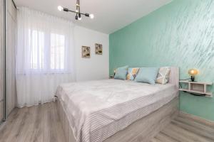 Postel nebo postele na pokoji v ubytování Apartman Gržetić