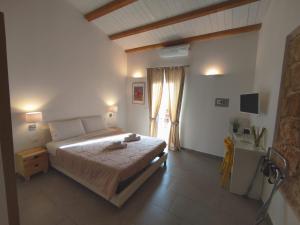 Posteľ alebo postele v izbe v ubytovaní B&B Cala Peppa