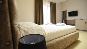 Voodi või voodid majutusasutuse Monte Mare Hotel toas