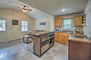 a kitchen with an island in the middle of a room at Near Natl Park Hollywood Park Hot Springs Home in Hot Springs