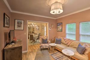 a living room with a couch and a tv at Renovated Home with Screened-In Patio on Hwy 90! in Quincy