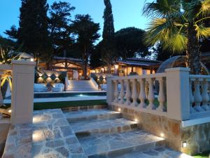 a staircase leading to a house with lights at La Villa Dune, Hôtel & Spa Nuxe in Saint-Tropez