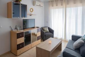 Televízia a/alebo spoločenská miestnosť v ubytovaní JARDINES DEL MAR I APTO 298 OROPESA DEL MAR MARINA DOR