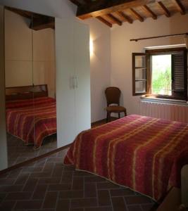 A bed or beds in a room at CasaLina appartamento a Casale Marittimo