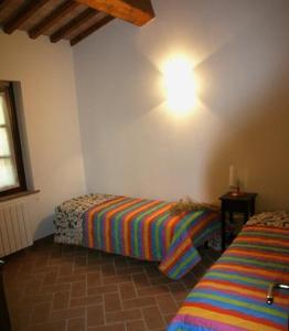 A bed or beds in a room at CasaLina appartamento a Casale Marittimo