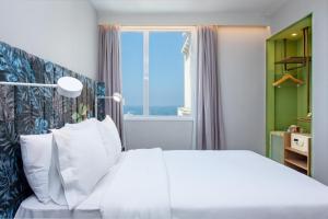 Postel nebo postele na pokoji v ubytování Mercure Rio Boutique Hotel Copacabana