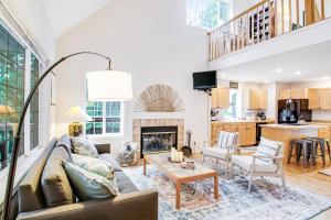 a living room with a couch and a table at Cottage at Moran State Park in Eastsound