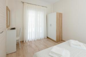 Postel nebo postele na pokoji v ubytování (Apt.2) Lofos Apartments in Vergia Halkidiki