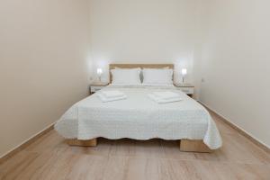 Postel nebo postele na pokoji v ubytování (Apt.2) Lofos Apartments in Vergia Halkidiki