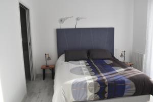 Кровать или кровати в номере RESIDENCE LE GALLION