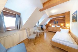 Postel nebo postele na pokoji v ubytování Hotel garni Alpengruss