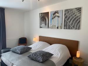 Postel nebo postele na pokoji v ubytování Am Meerturm