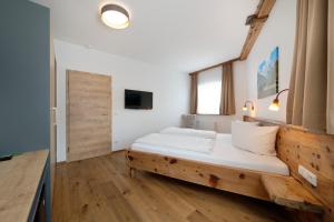 TV a/nebo společenská místnost v ubytování Hotel garni Alpengruss