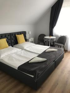 Postel nebo postele na pokoji v ubytování Tóranéző Ház