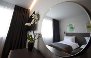 Postel nebo postele na pokoji v ubytování Hotel Botanica