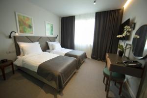 Postel nebo postele na pokoji v ubytování Hotel Botanica
