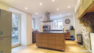 a kitchen with a sink and a counter top at B&B Colvestre in Tréguier