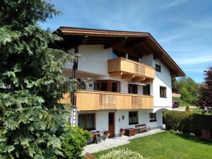 a view of a house with a balcony at Landhaus Kirchmair in Telfes im Stubai