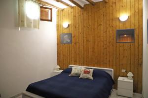 Postel nebo postele na pokoji v ubytování Casa Vacanze Lorenzo