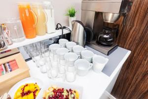 Příslušenství pro přípravu čaje a kávy v ubytování Adresa Suites
