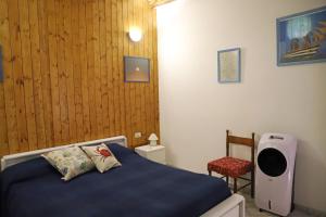 Postel nebo postele na pokoji v ubytování Casa Vacanze Lorenzo