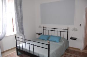 Posteľ alebo postele v izbe v ubytovaní Arena Alfieri B&B