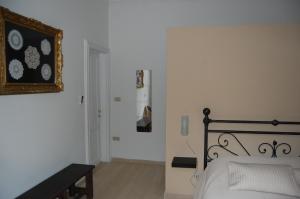 Posteľ alebo postele v izbe v ubytovaní Arena Alfieri B&B