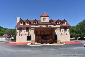 a large building with a tower on top of it at Baymont by Wyndham Helen in Helen