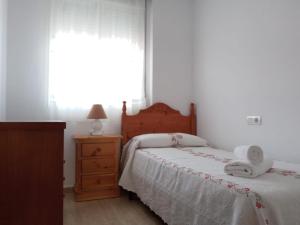 Posteľ alebo postele v izbe v ubytovaní Apartamento familiar.