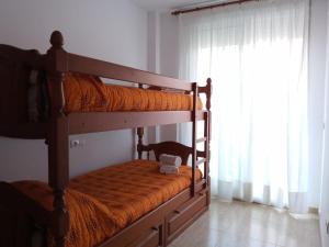Posteľ alebo postele v izbe v ubytovaní Apartamento familiar.