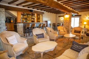 The lounge or bar area at Le Moulin d'Hauterive