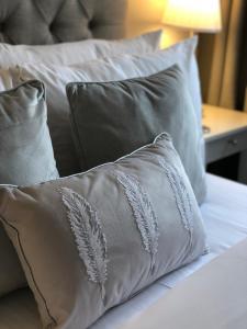 a silver pillow sitting on top of a bed at Chadberry House Hotel in Blackpool