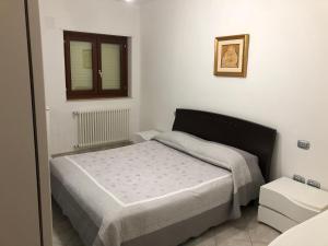 A bed or beds in a room at Casa vacanza bella Puglia