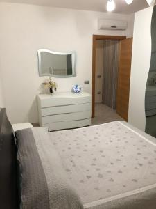 A bed or beds in a room at Casa vacanza bella Puglia