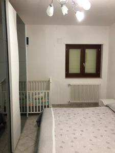A bed or beds in a room at Casa vacanza bella Puglia