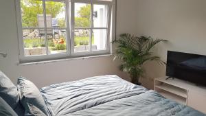 Säng eller sängar i ett rum på Apartment Charly - Aktivurlaub im Herzen Bayerns