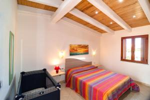 Postel nebo postele na pokoji v ubytování Case Vacanze Budoni Beach