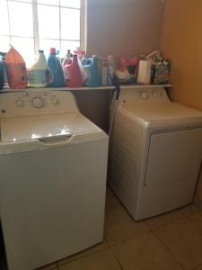 a laundry room with a washing machine and a window at St. Anna's House in Squaw Valley