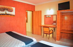 TV a/nebo společenská místnost v ubytování Hotel Hacienda Sánchez