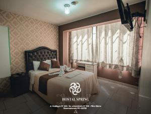 Postel nebo postele na pokoji v ubytování Hostal Spring II