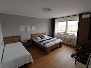 Postel nebo postele na pokoji v ubytování Apartmán Lenka