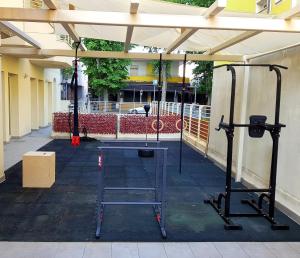 a building with a gym with two tread machines at Wally Residence in Rimini