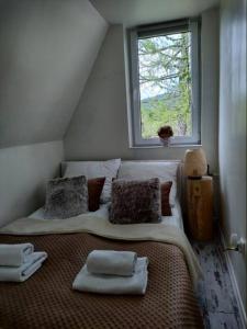 
Łóżko lub łóżka w pokoju w obiekcie Willa Kościelisko
