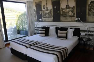 
Cama ou camas em um quarto em LBV House Hotel
